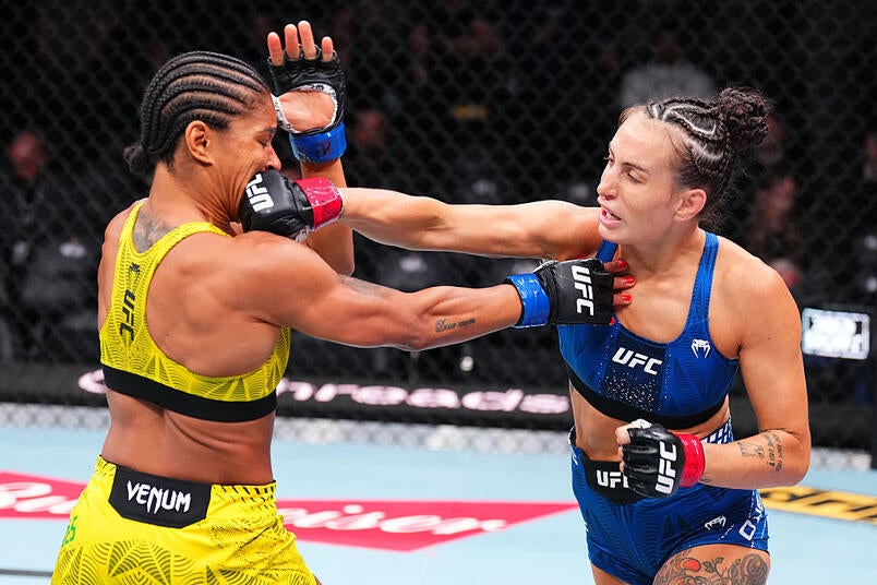 Casey O'Neill lands a punch during a UFC fight
