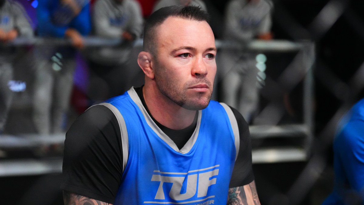 Colby Covington wearing a blue RAF wrestling singlet
