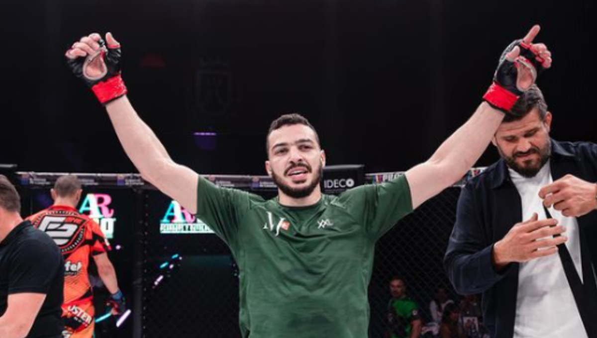 Ilias Bulaid celebrates an MMA victory inside the cage