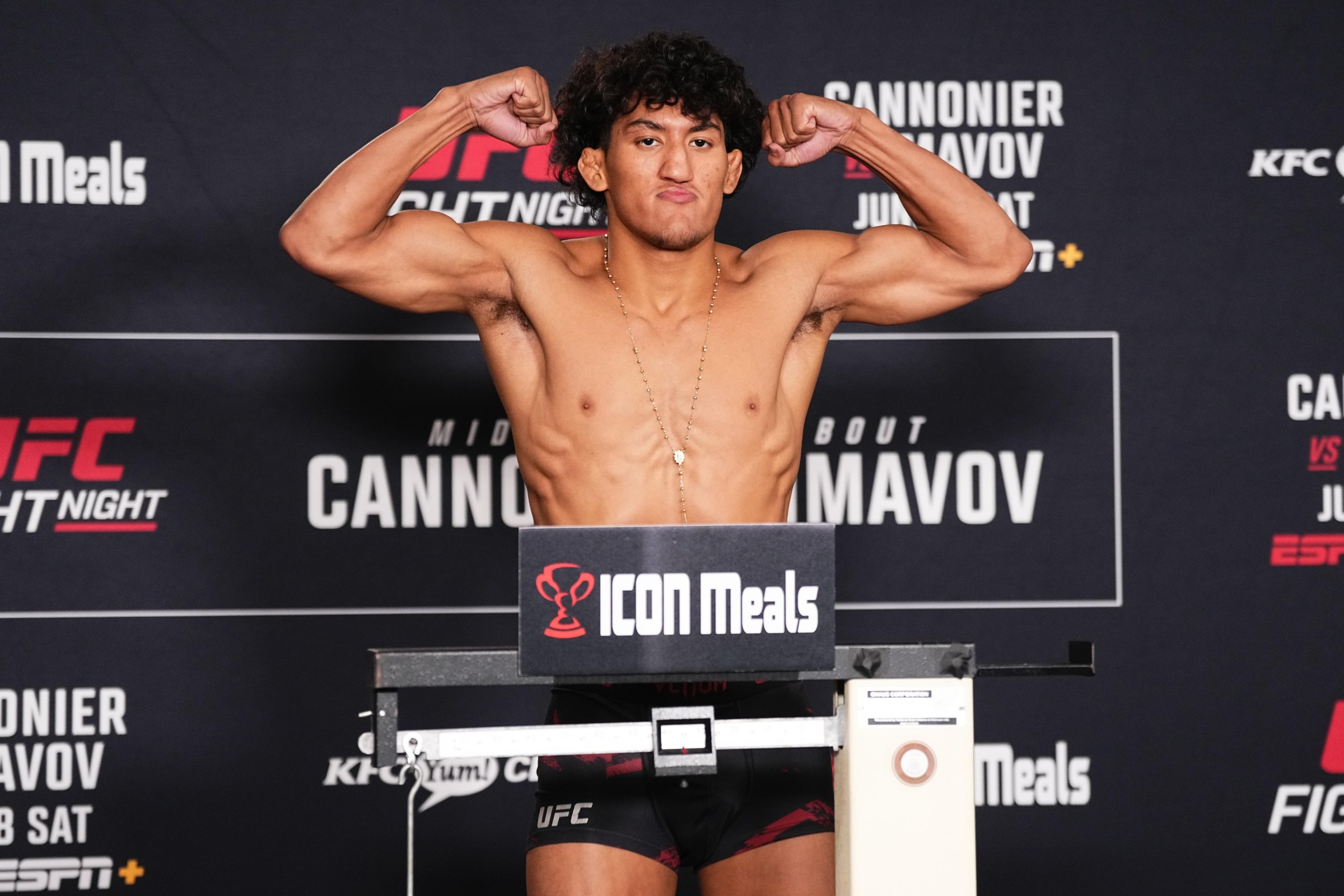Raul Rosas Jr. poses on the scale at a UFC official weigh-in