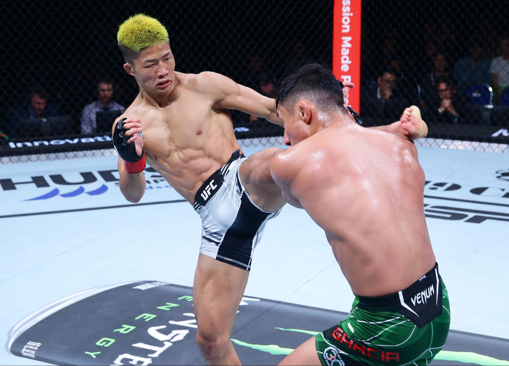 Rinya Nakamura lands a kick during a UFC bantamweight bout