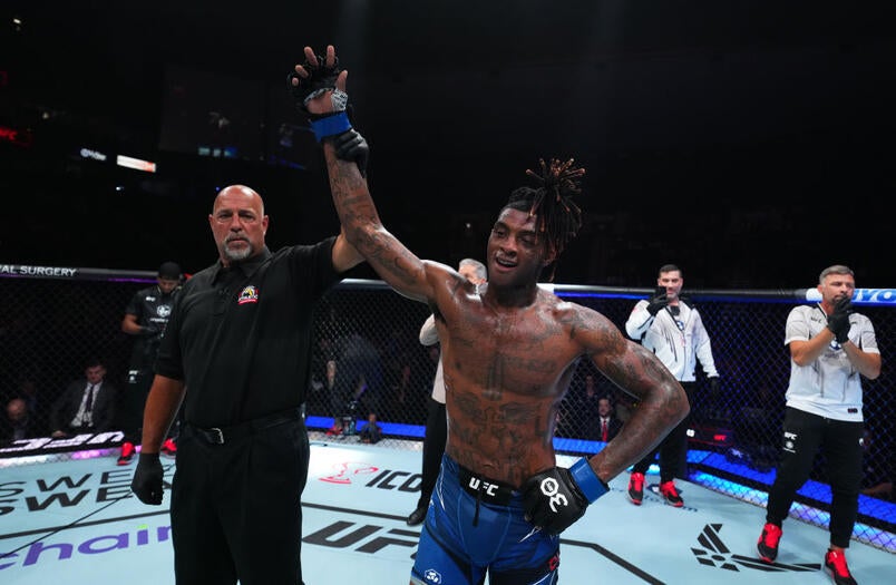 Sedriques Dumas celebrates a UFC victory inside the octagon