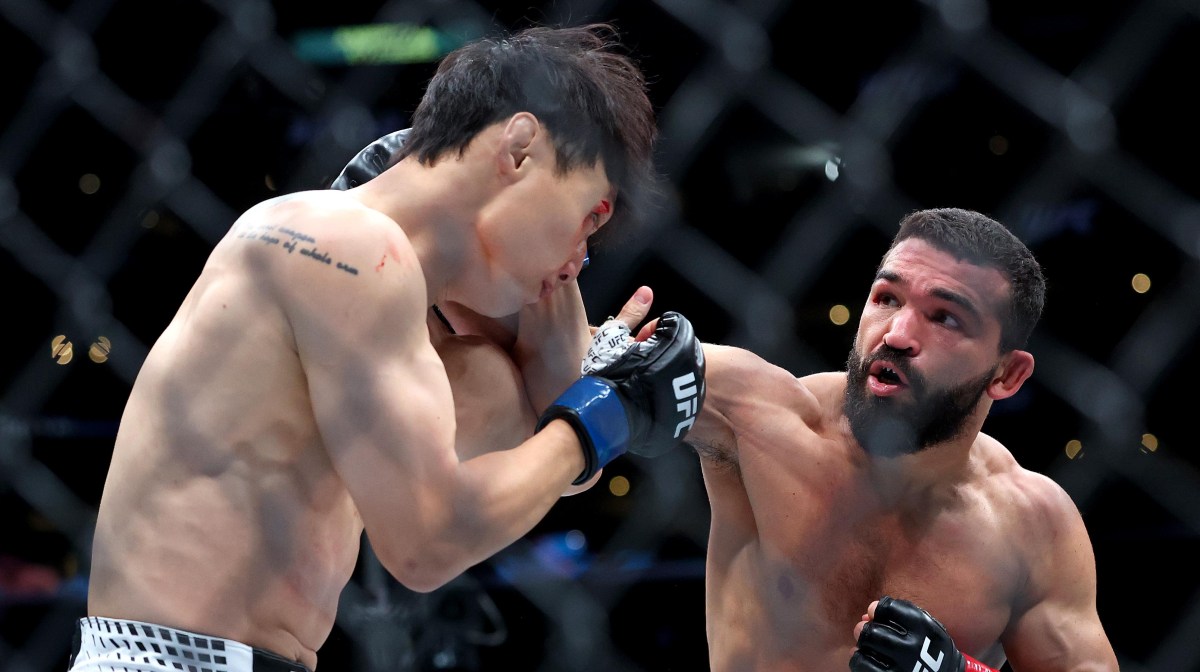 Patricio Pitbull lands a right hand on Doo Ho Choi during their UFC 331 fight