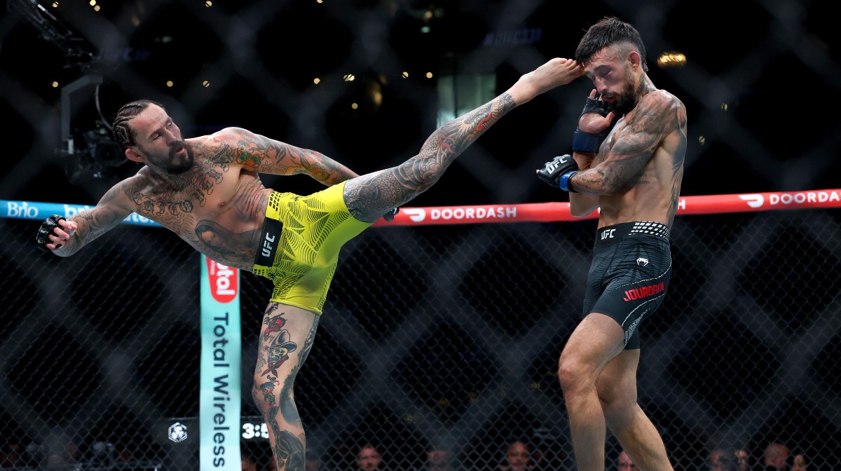 Marlon Vera attacks Charles Jourdain with a head kick at UFC 331