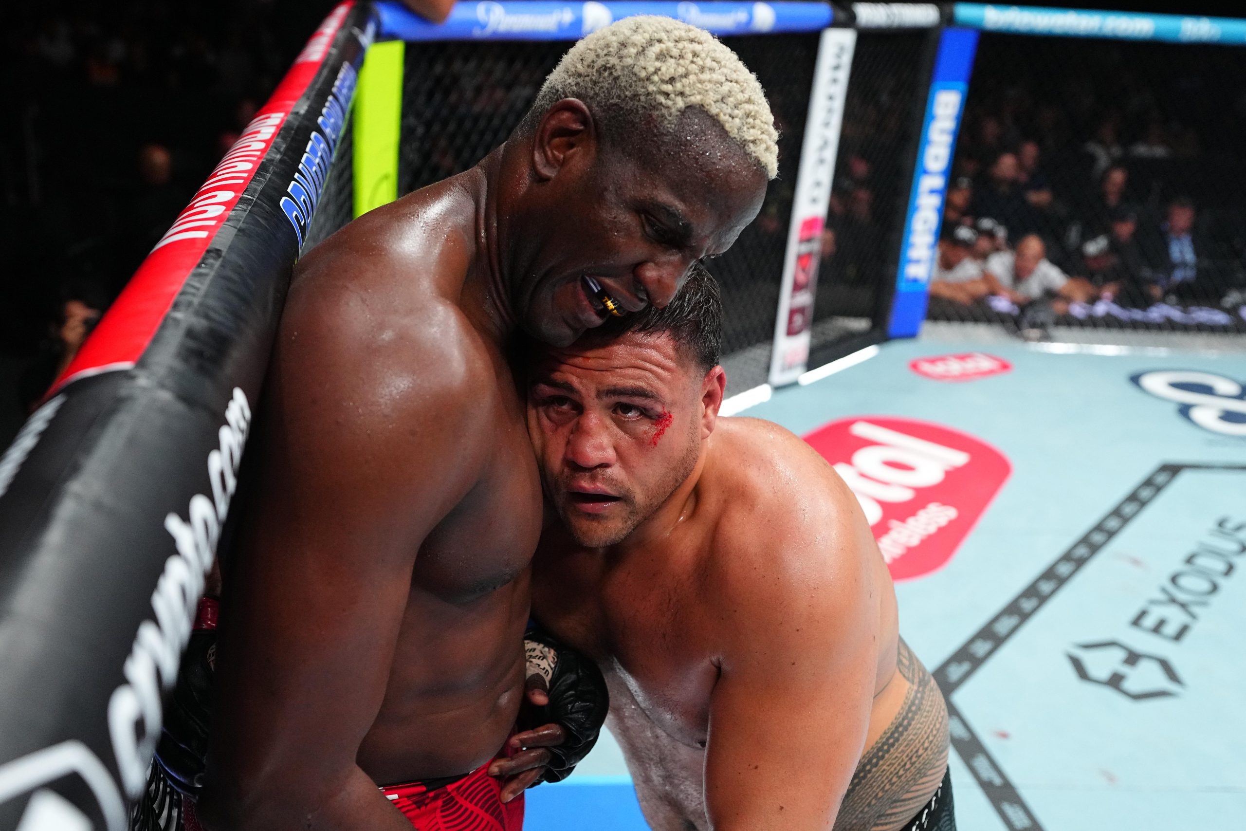 Robelis Despaigne and Tai Tuivasa grapple against the fence during UFC 331