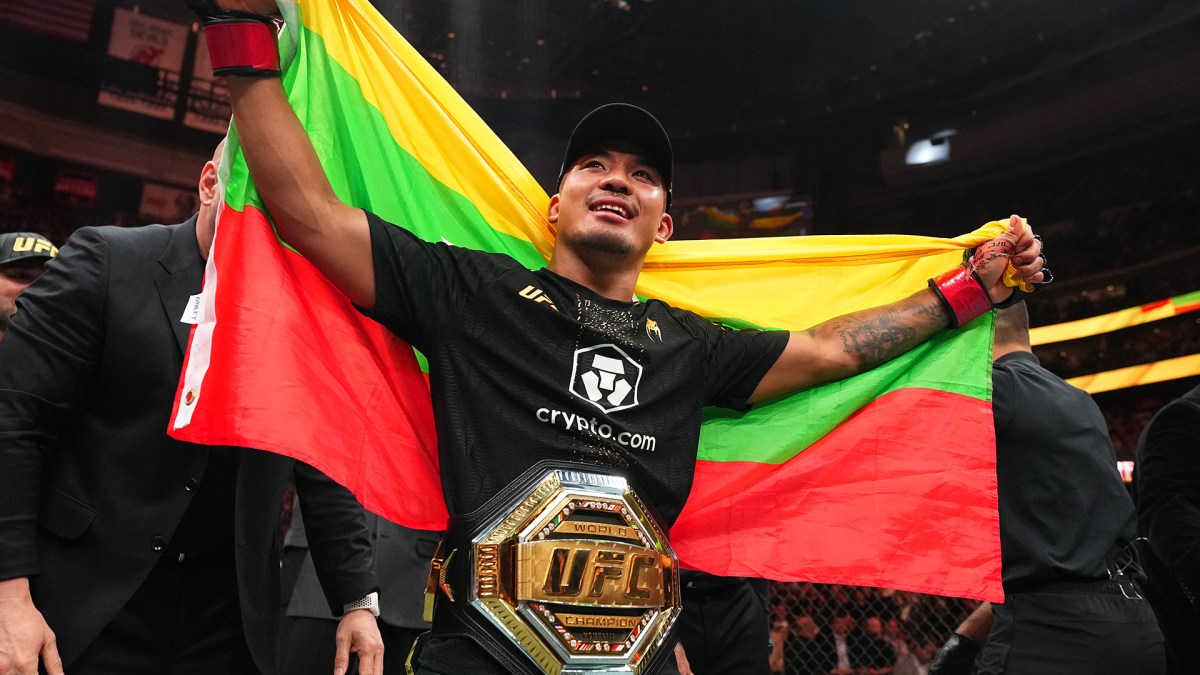 Joshua Van celebrates his UFC 328 title defense with the Myanmar flag