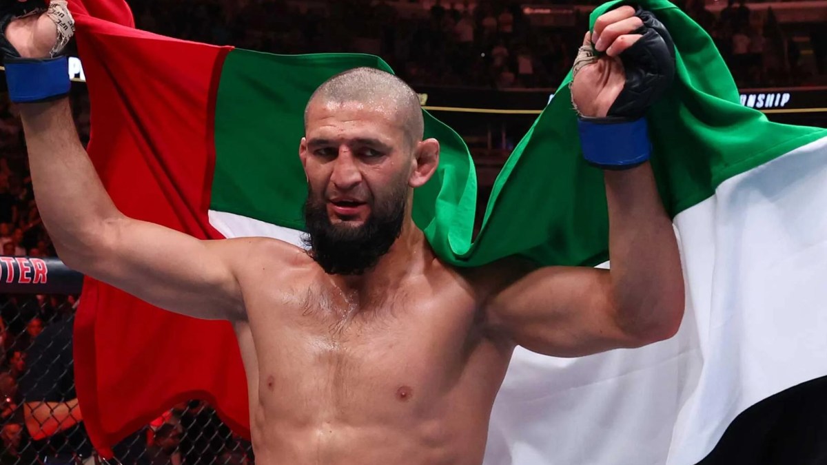 Khamzat Chimaev celebrates after winning the UFC middleweight championship